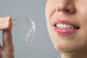 woman with invisible aligner