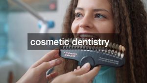 a patient's teeth being checked for color matching